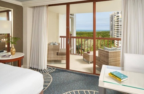 Pelican Bay Resort | Relax in Three Relaxing Rooms with Balcony, Beach & Outdoor Pool Access