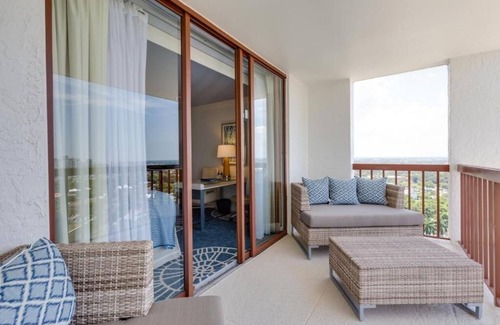 Pelican Bay Resort | Relax in Three Relaxing Rooms with Balcony, Beach & Outdoor Pool Access