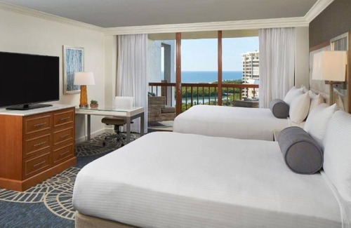 Pelican Bay Resort | Relax in Three Relaxing Rooms with Balcony, Beach & Outdoor Pool Access