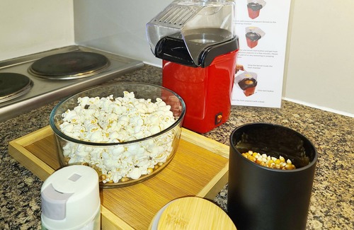 Bonifacio Global City Condo | Relax to a family size condo with fun games, popcorn and cinematic movie.