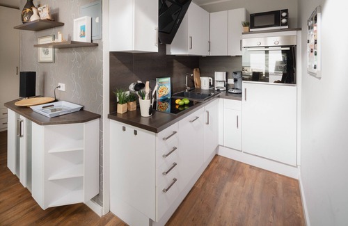 Norderney Apartment | "Relax with a sea view: Above the rooftops of Norderney"