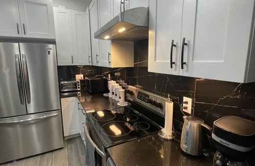 Harcourt Cottage | Relax with the family on the lake front with modern living in natural wilderness