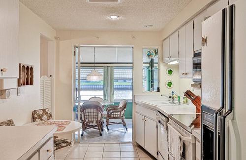 Port Charlotte House | Relax, Work, or Play in this Retro Waterfront Home with Sunsets & Private Dock