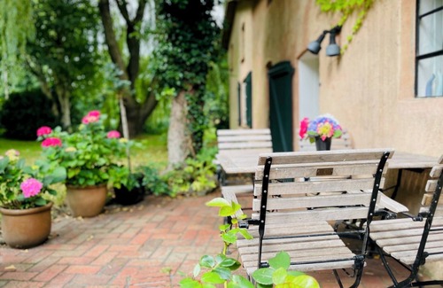 Scheggerott House | Relaxing vacation in stylish house with park-like garden, grand piano, library