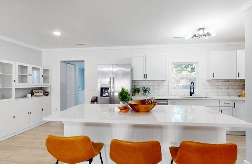 Shell Point House | Remodeled cozy ocean themed home with outdoor seating & firepit
