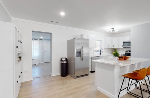 Shell Point House | Remodeled cozy ocean themed home with outdoor seating & firepit