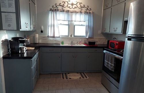 Iola House | Renovated Bungalow with Cozy Gas Fireplace