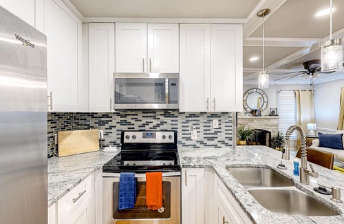 East Point House | Renovated downtown house w/enclosed backyard, deck, fireplace, central AC & W/D