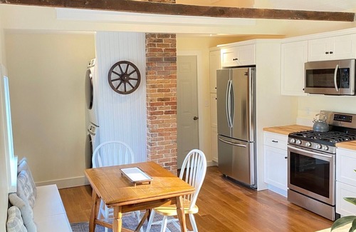 Kennebunk House | Renovated farmhouse featuring two connected rental units with an interior access door. Large Yard
