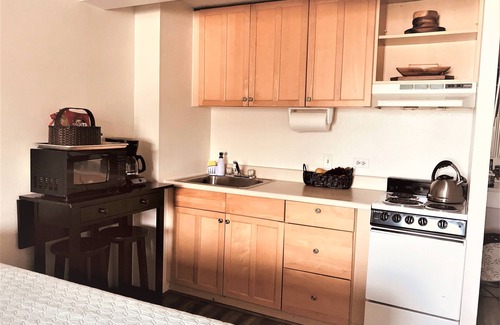 McCully - Moiliili Hotel | renovated studio room with two queen beds, full kitchen and full bath