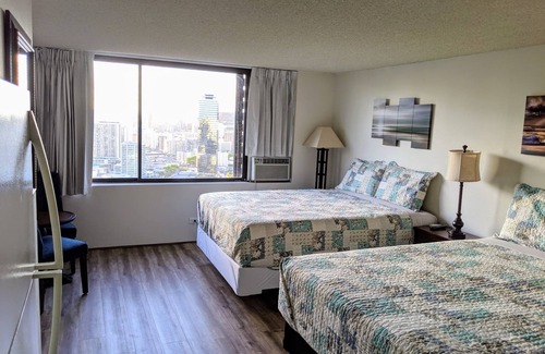 McCully - Moiliili Hotel | renovated studio room with two queen beds, full kitchen and full bath