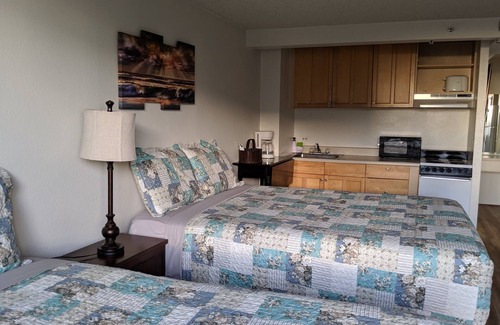 McCully - Moiliili Hotel | renovated studio room with two queen beds, full kitchen and full bath