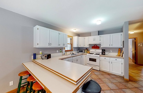 Thompsonville House | Resort home with private indoor hot tub, game room, firepit, bikes, Ping-Pong