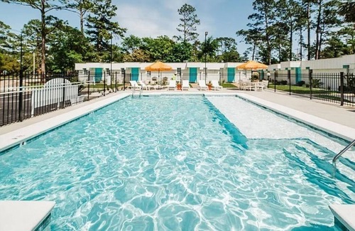 Gulf Shores Condo | Retro Retreat: Near beach, beautiful pool, walk to park and coffee shop.