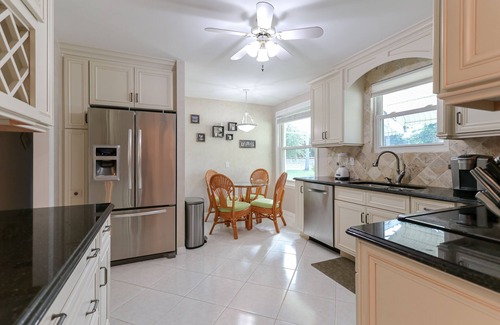 Roseland House | Riverfront Retreat, Private Docks, on Small Acreage.