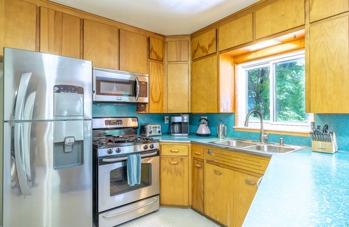 Dexter House | Riverside retreat with hot tub on the Huron River! 10 miles to UofM!