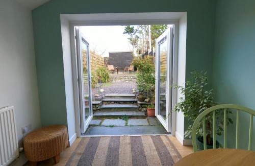 Tywyn House | Romantic coastal getaway with hot tub & log burner