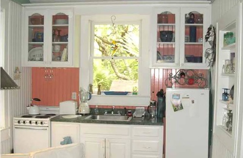 Folly Beach Cottage | Romantic, cozy cottage nestled amongst live oaks & palms, a block from beach.