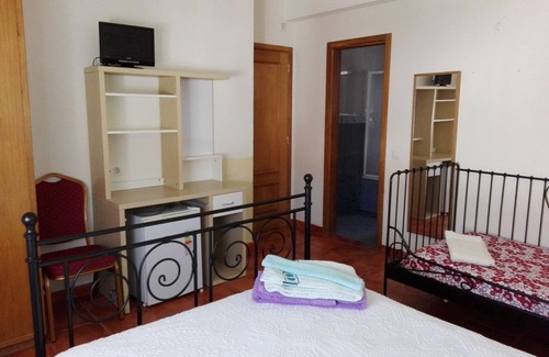 Porto Covo House | Room 'Quarto 8' in Porto Covo with a Fan