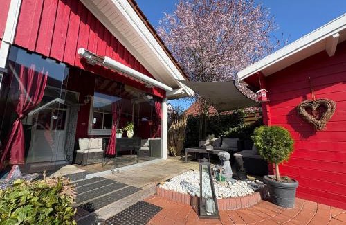 Haseluenne Apartment | Rotes Ferienhaus im charmanten Schwedenhausviertel