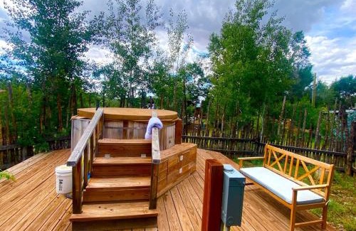 San Cristobal House | Rustic Log Cabin on Eco-Friendly Farm near Taos, New Mexico