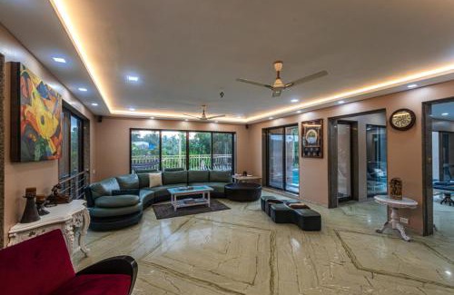 Alibaug Villa | SaffronStays Aura, Alibaug - luxury pool villa with a game room and spacious lawn