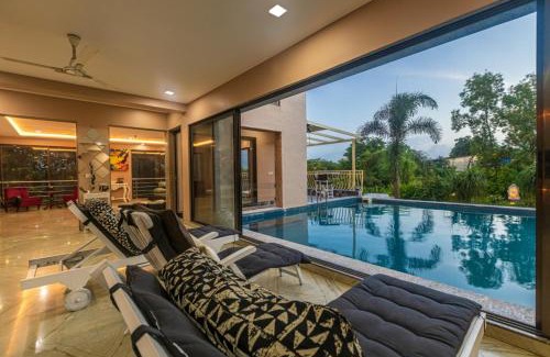 Alibaug Villa | SaffronStays Aura, Alibaug - luxury pool villa with a game room and spacious lawn