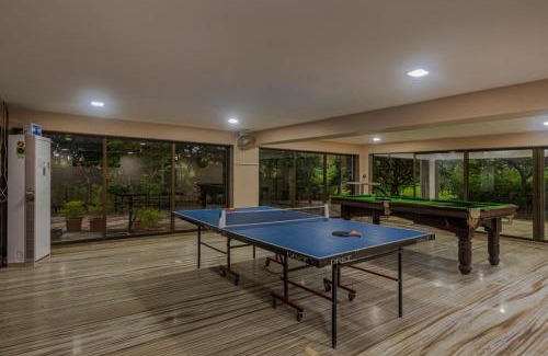 Alibaug Villa | SaffronStays Aura, Alibaug - luxury pool villa with a game room and spacious lawn