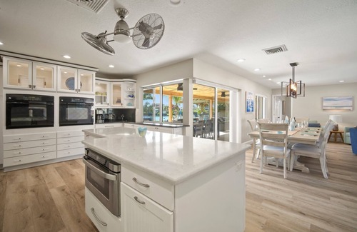 Bal Harbour House | Saltwater canal front 4 bedroom tropical home with private pool and boat dock