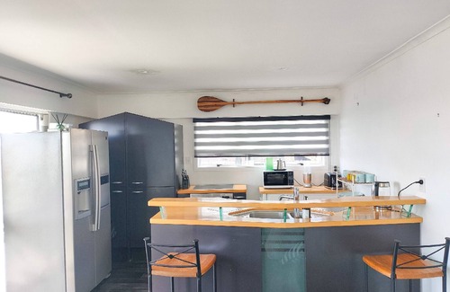 Pukehina House | "Salty Dog Beach Bach" is a comfortable and no-frills beachfront retreat.