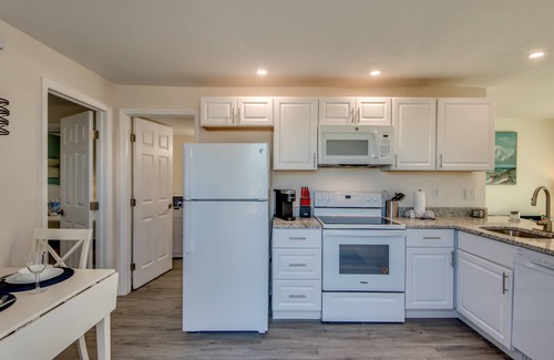 South Island House | Sand Dollar #2 - Downstairs Apt w Shared Pool on Canal by the Beach!