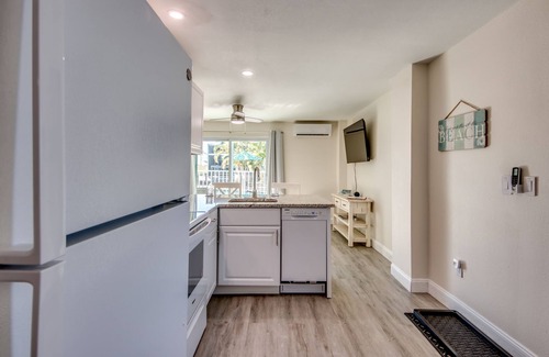 South Island House | Sand Dollar #2 - Downstairs Apt w Shared Pool on Canal by the Beach!