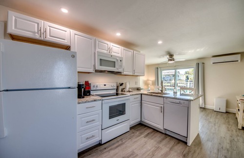 South Island House | Sand Dollar #2 - Downstairs Apt w Shared Pool on Canal by the Beach!