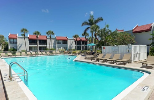 Bradenton Beach Condo | Sandy Feet Retreat Unit 108 at Runaway Bay. 1 min walk to beach.