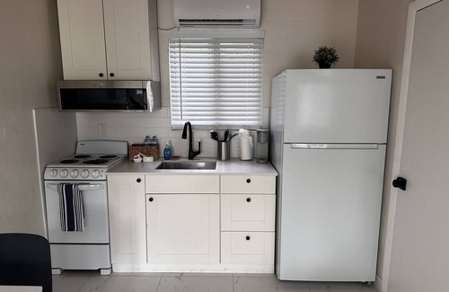 Sea Ranch Lakes Hotel | Sapphire by the Sea Unit 3 - King Bed, kitchen, pool view, Sleeps 2