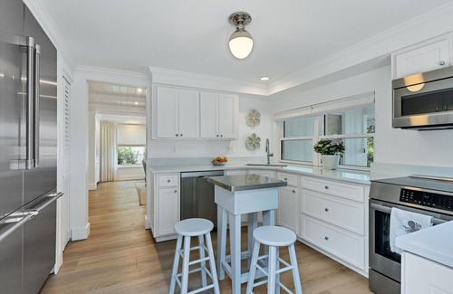 Cherokee Park House | Sarasota Renovated Waterfront Home with Dock Wide Open Bay Views Heated Pool
