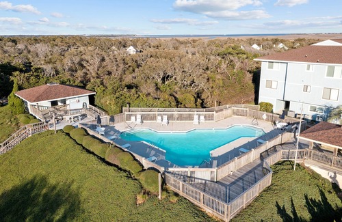 Caswell Beach Condo | Scenic Caswell Beach! 3 Mins to Beach & Pool. Clean + Conveniently Located