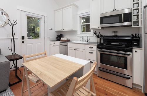 Pacific Beach Cabin | Seabrook 2 Bedroom cottage with hot tub, a wooded setting. Pet friendly and AC!