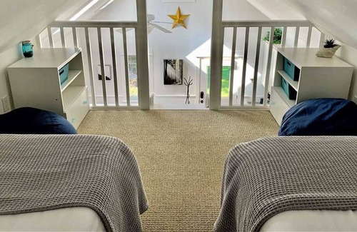 Seabrook House | Seabrook's Slack Tide, a cozy loft style cabin in Beach Camp!