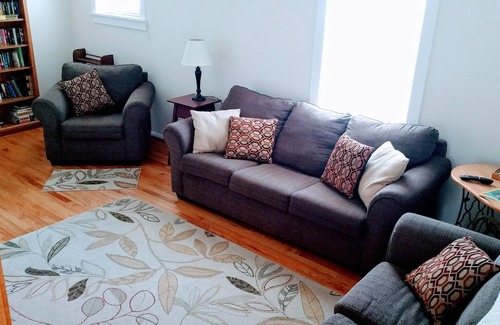 Colonial Beach House | Seaside Serenity: Charming Cottage Steps from Sandy Beach & Downtown Delights