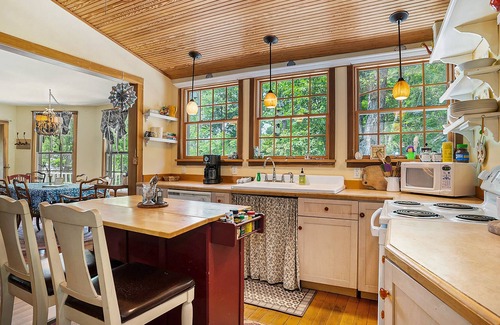 Fennville Cottage | Secluded lakefront cottage with sweeping views, huge deck, washer/dryer, & WiFi