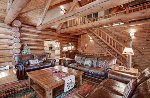Eagle River House | Secluded waterfront log cabin with game room, dock, fire pit & deck
