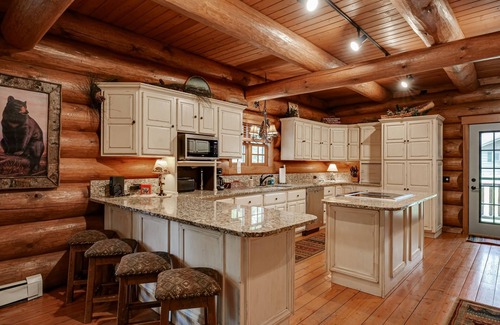 Eagle River House | Secluded waterfront log cabin with game room, dock, fire pit & deck