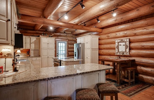 Eagle River House | Secluded waterfront log cabin with game room, dock, fire pit & deck