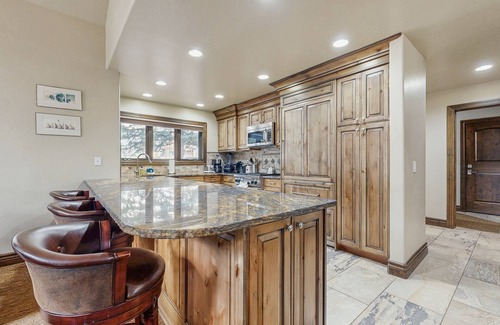 Warm Springs House | Ski-in/ski-out chalet with fireplace, furnished deck, & alfresco dining