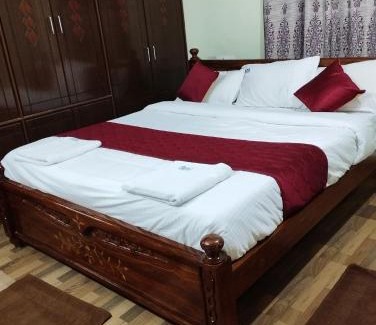 Tirupati Apartment | SLS Homestay - Luxury AC Service Apartments 1BHK, 2BHK, 3BHK - Direct Flyover to Alipiri Tirumala Gate - Walk to PS4 Pure Veg Restaurants, Supermarkets - Near to National Highway & Padmavathi Amma Temple - Modular Kitchen, Living room -Free Superfast Wifi
