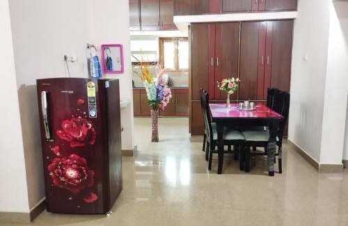 Tirupati Apartment | SLS Homestay - Luxury AC Service Apartments 1BHK, 2BHK, 3BHK - Direct Flyover to Alipiri Tirumala Gate - Walk to PS4 Pure Veg Restaurants, Supermarkets - Near to National Highway & Padmavathi Amma Temple - Modular Kitchen, Living room -Free Superfast Wifi