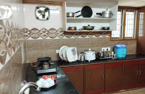Tirupati Apartment | SLS Homestay - Luxury AC Service Apartments 1BHK, 2BHK, 3BHK - Direct Flyover to Alipiri Tirumala Gate - Walk to PS4 Pure Veg Restaurants, Supermarkets - Near to National Highway & Padmavathi Amma Temple - Modular Kitchen, Living room -Free Superfast Wifi