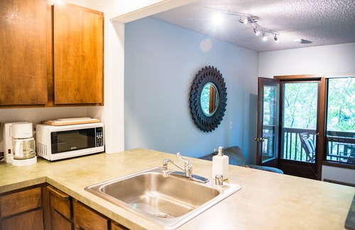 Glacier Condo | Snowater Resort ~ King Bed, Wood Fireplace, WIFI, Pet friendly. Pool and clubhouse access!