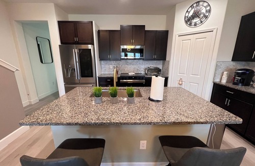 Palm River-Clair Mel House | Spacious 4-bedroom townhome with WiFi, AC in charming Tampa